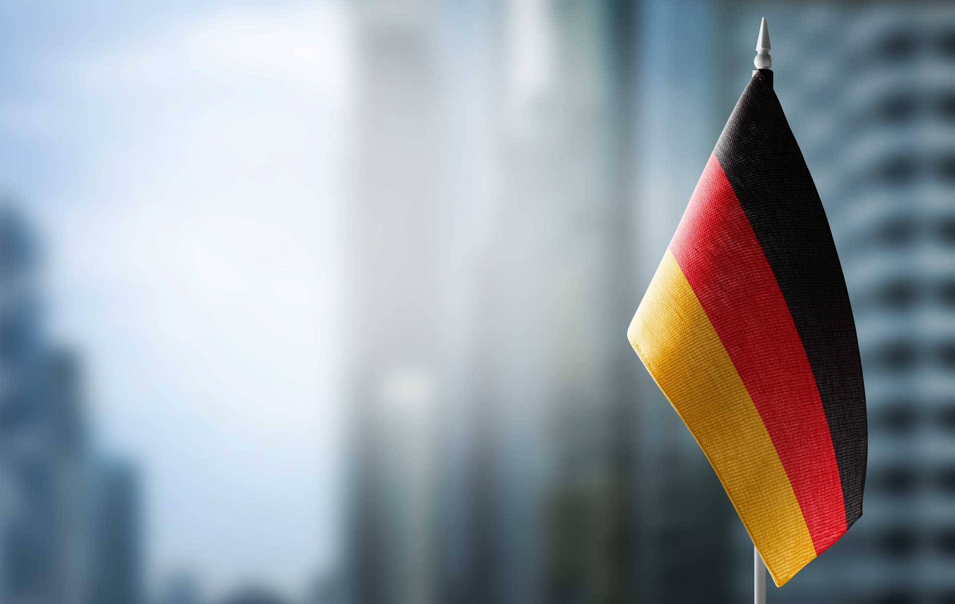 small flag germany blurred city