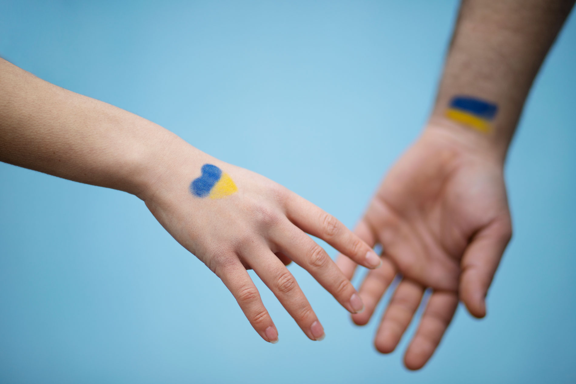 ukrainian flags hands